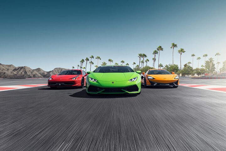 Exotic Racing Exotic sports cars racing on a professional track with palm trees, desert scenery, and motion blur effect